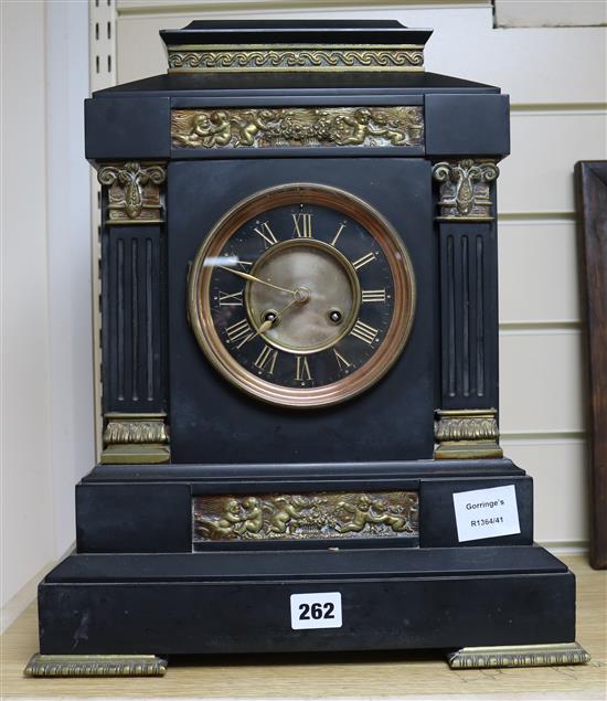 A large 19th century French black marble eight day mantel clock, with gilt brass inset panels, height 42.5cm